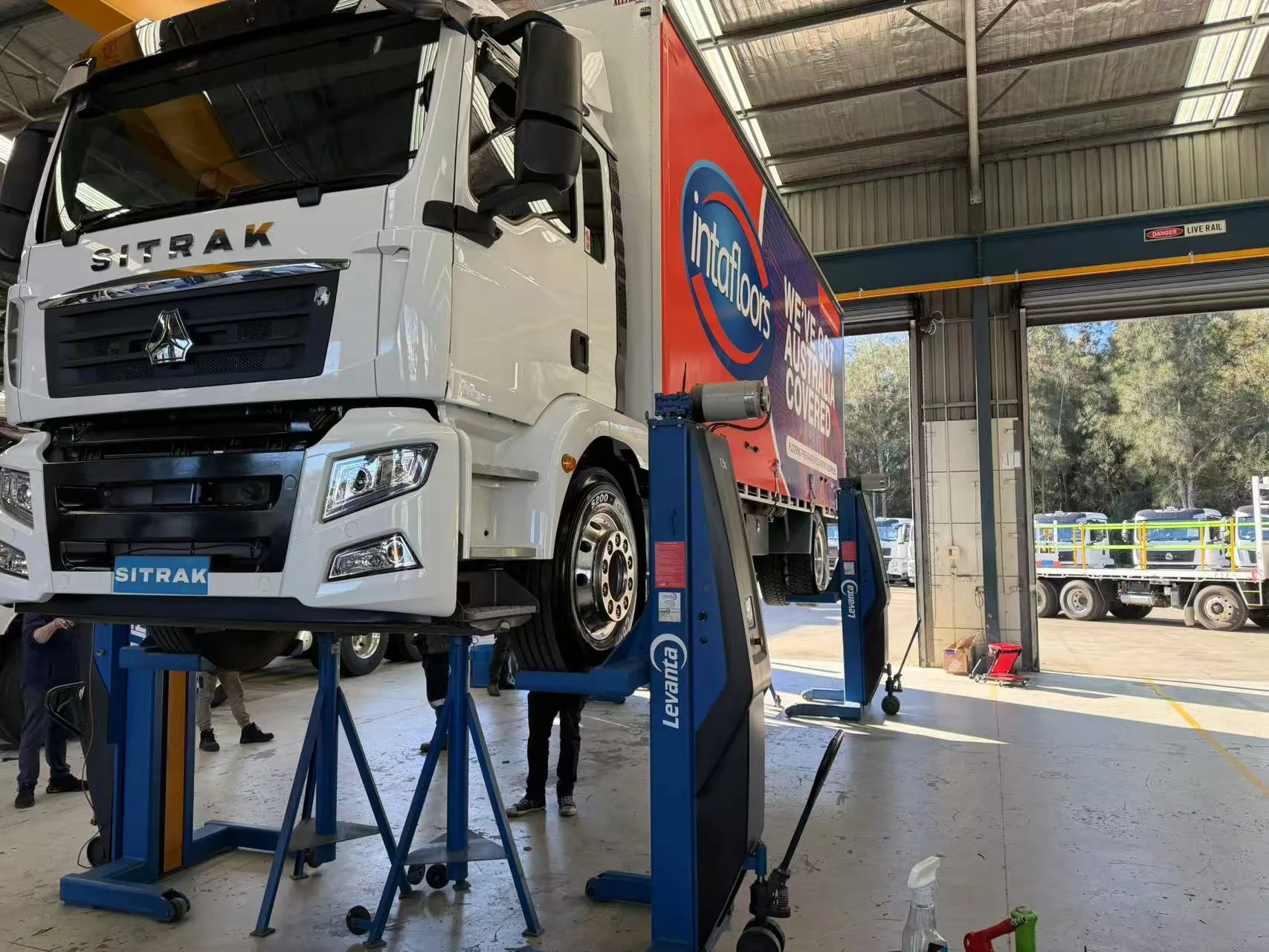 SITRAK truck raised on workshop lifts at RUMBLE Auto